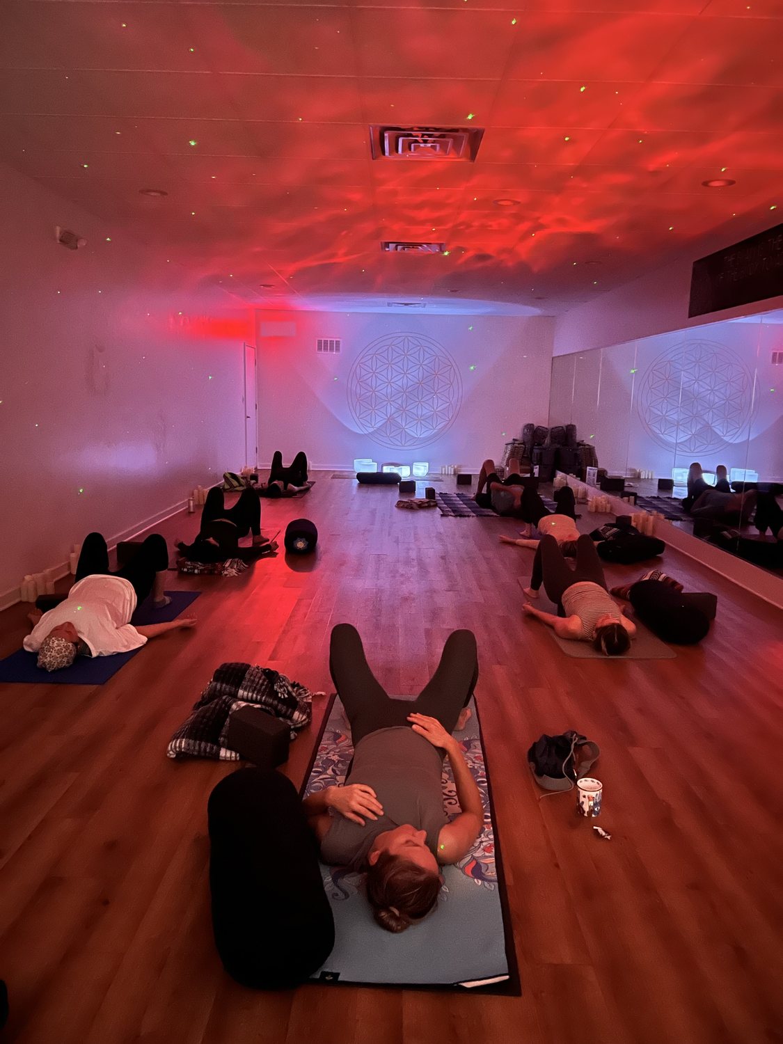 Group sound bath in session, bathed in warm light